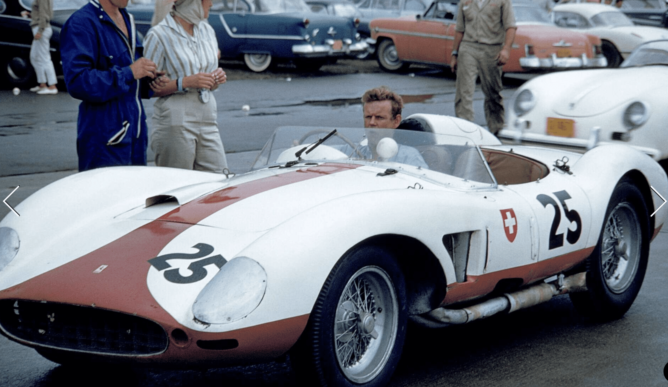 Vintage race car with number 25 on track.
