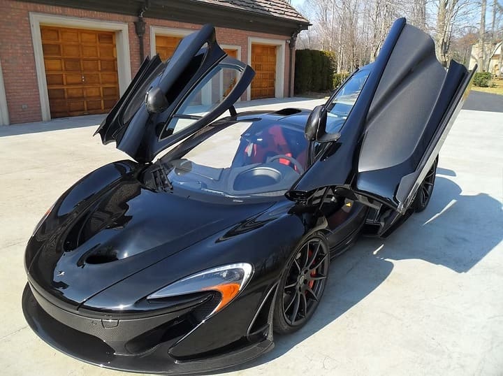 Sleek luxury car parked outside garage