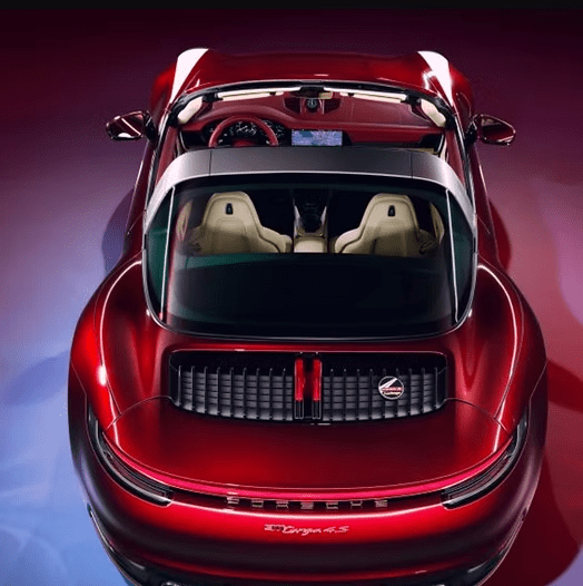 Red sports car with open sunroof