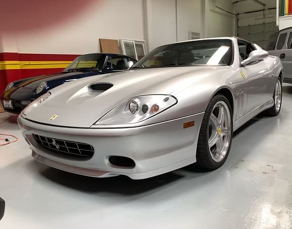 Sleek silver car with shiny wheels
