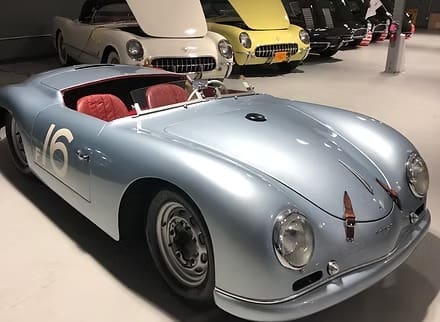 Vintage silver sports car with red interior