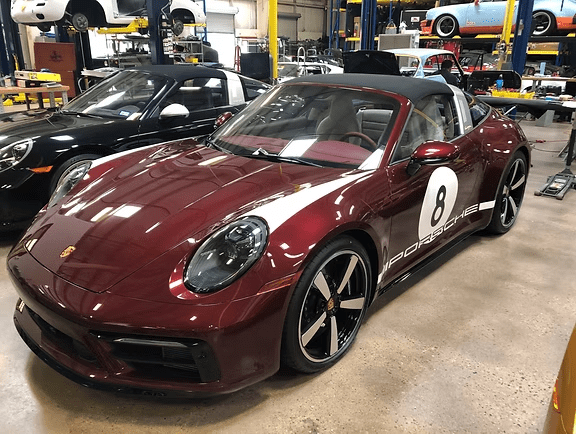 Burgundy convertible parked in garage