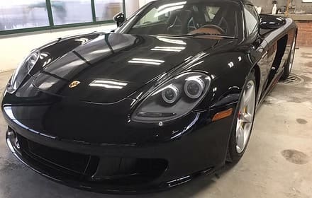 Shiny black luxury vehicle indoors