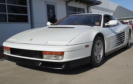 Classic white sports car on pavement