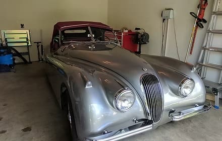 Classic silver car parked in garage