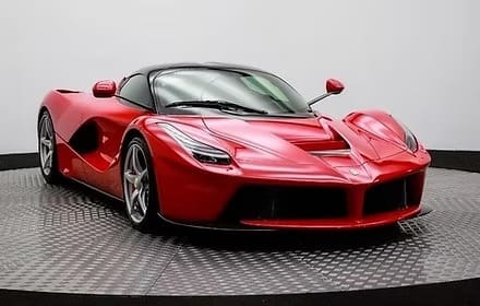 Sleek red car with black roof