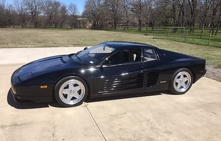 Black sports car parked outdoors