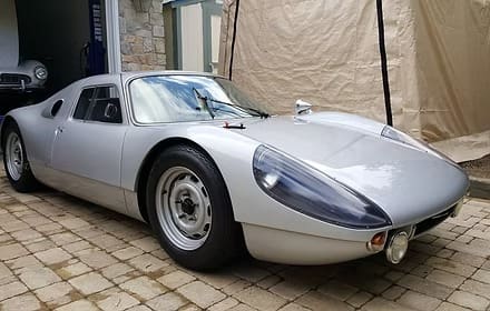 Vintage sports car on cobblestone driveway