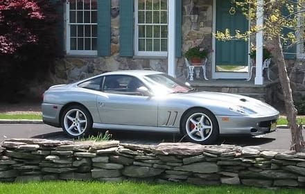 Luxury car in front of house