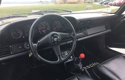 Vintage car dashboard with steering wheel