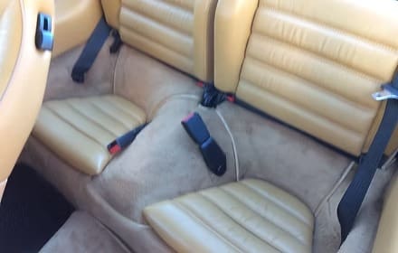 Tan leather car seats with seatbelts