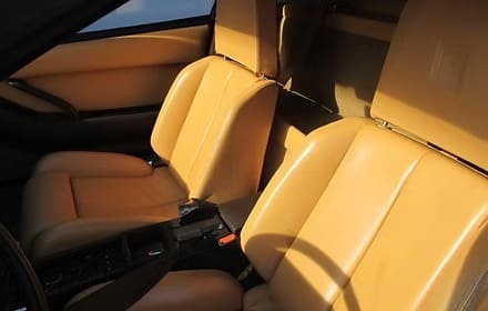 Tan leather car seats in sunlight