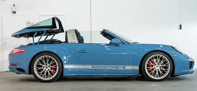 Side view of blue Porsche convertible