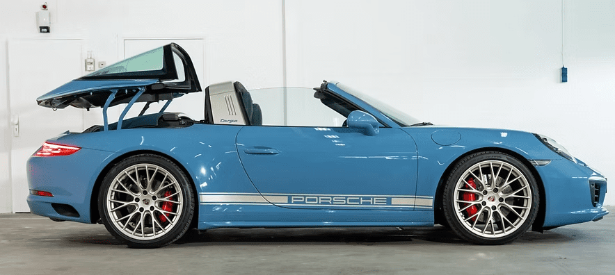 Side view of blue Porsche convertible