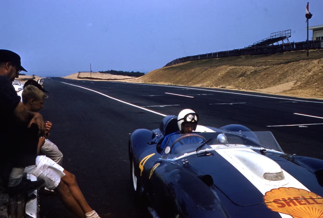 Driver in classic racing helmet