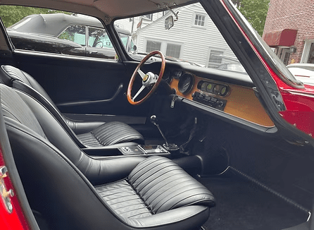 Vintage vehicle dashboard and steering wheel