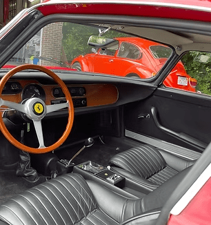 Classic car interior with red exterior view