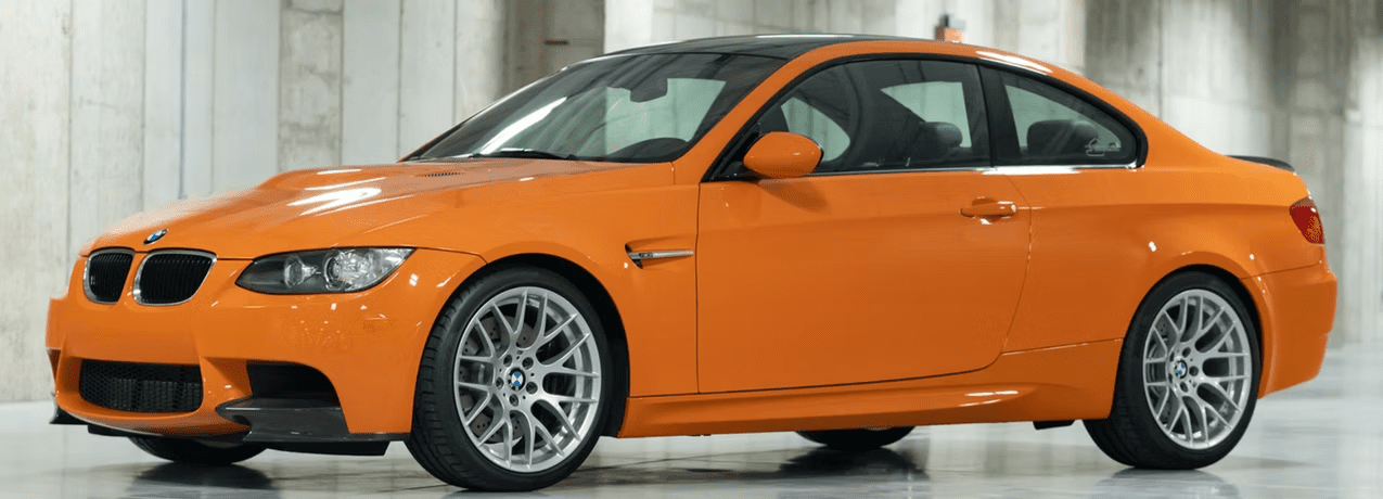 Stylish orange car with silver wheels