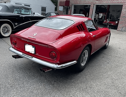 Classic car with sleek design in driveway