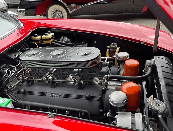 Red car engine components visible