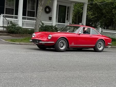 Classic red coupe in residential area