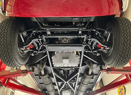 Vehicle underside showing wheels and components