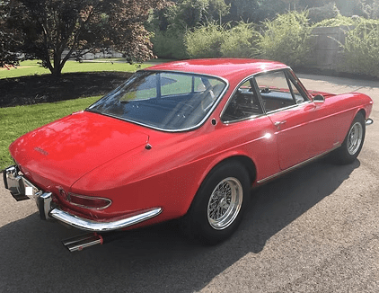Classic red coupe on sunny day