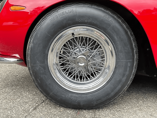 Red car with chrome wheel detail