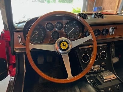 Vintage wooden steering wheel in sports car