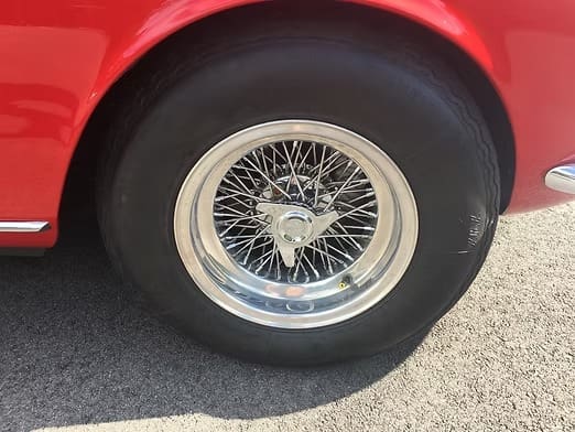 Red car with chrome wheel