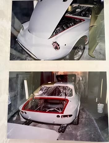 White car being repaired indoors