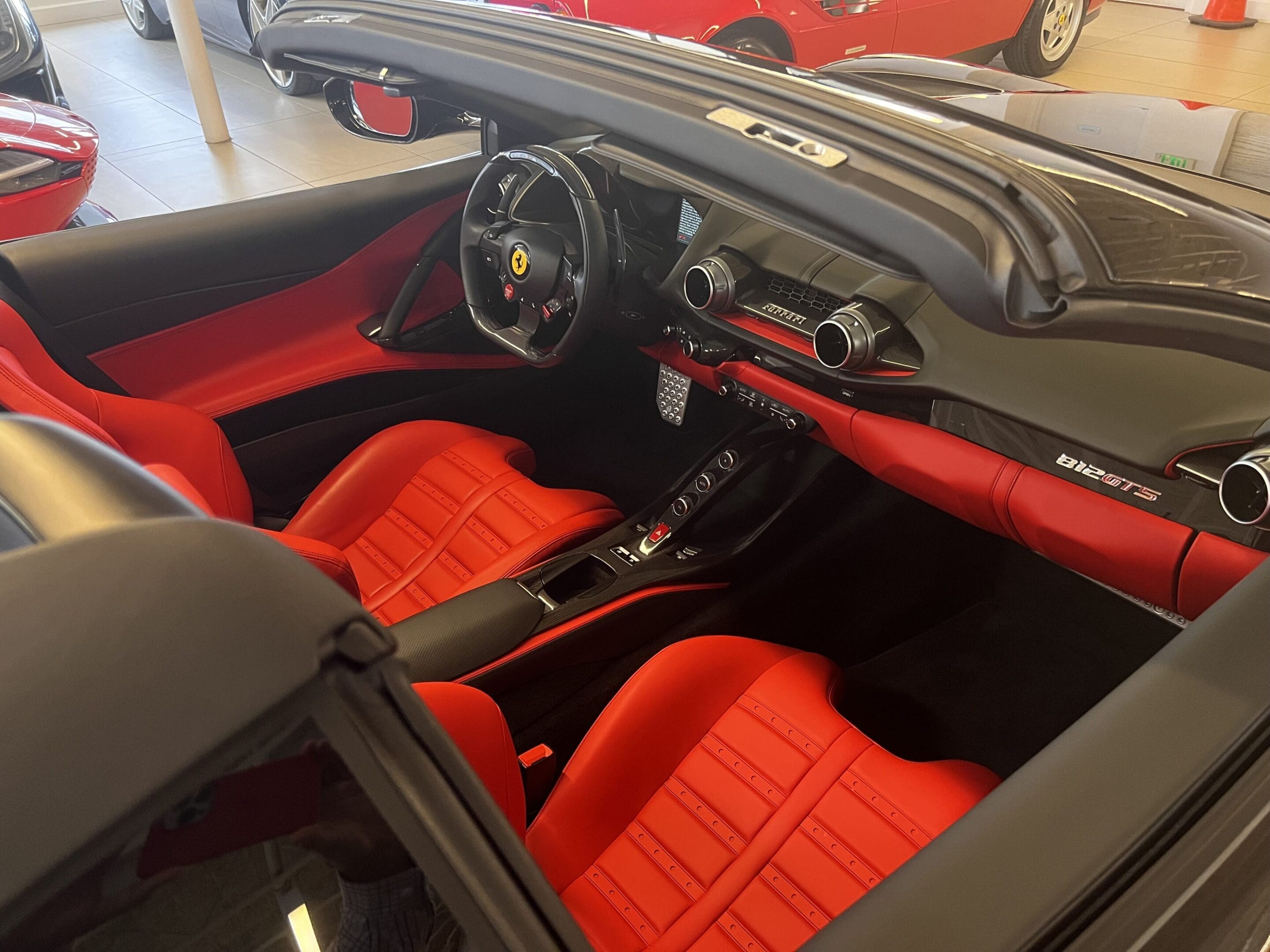 Ferrari convertible interior with red leather seats