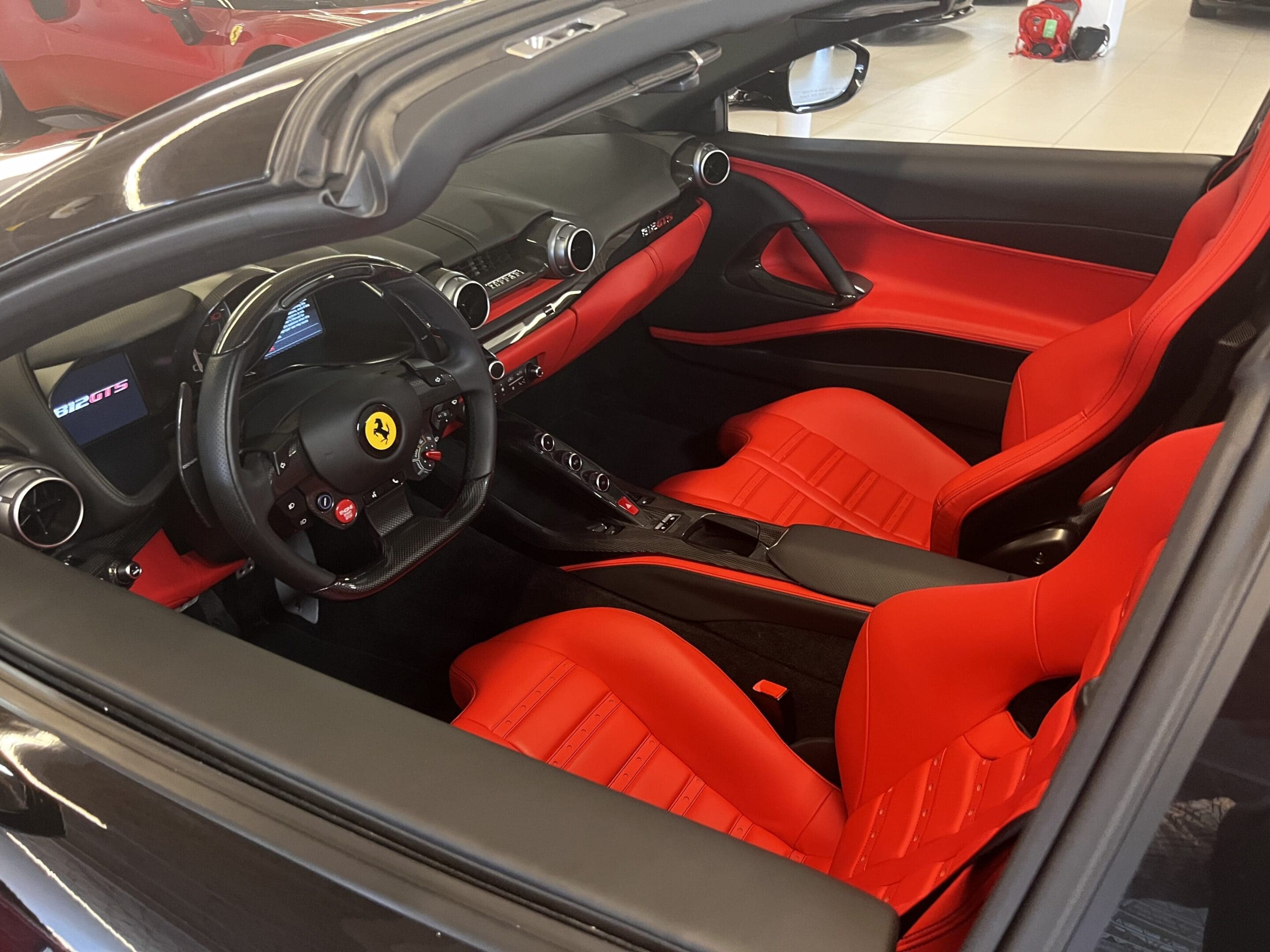 Ferrari convertible interior with red leather seats